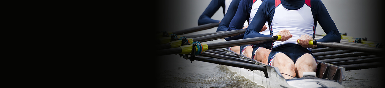 Photograph of a group of people rowing